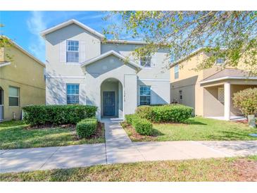 Two-story house with gray siding, landscaping, and walkway at 13419 Lake Monroe Pl, Riverview, FL 33579