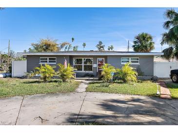 Gray house with palm trees and a long driveway at 4019 Helena Ne St, St Petersburg, FL 33703