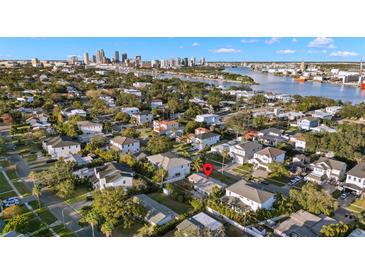 Aerial view showing a house and city skyline in the background at 612 Danube Ave, Tampa, FL 33606