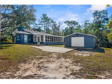Newly renovated home with detached garage, sunroom and large backyard at 25888 Whipperwill St, Brooksville, FL 34601