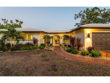 Attractive mid-century modern home with landscaped walkway at 4000 40Th S St, St Petersburg, FL 33711