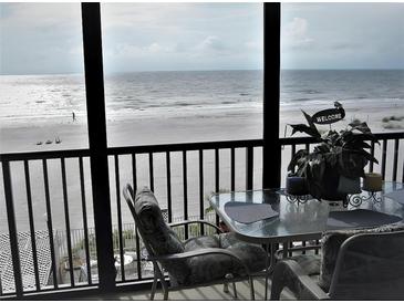 Stunning ocean view from private balcony, featuring table and chairs at 20040 Gulf Blvd # 302, Indian Shores, FL 33785