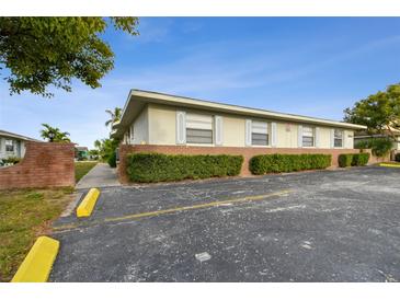 Brick building exterior with parking and landscaping at 1025 Apollo Beach Blvd # D, Apollo Beach, FL 33572