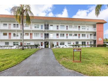 Two-story building with landscaped grounds and parking at 5728 14Th N Ave # 305B, St Petersburg, FL 33710