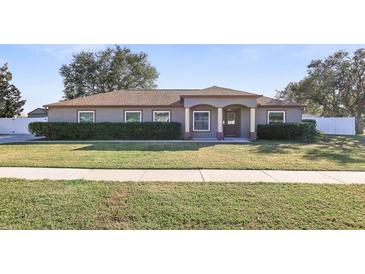 Single-story house with a landscaped lawn and neutral exterior at 6515 Clair Shore Dr, Apollo Beach, FL 33572