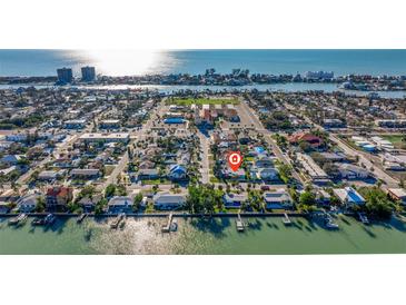 Aerial view showing home's location near water at 8300 Boca Ciega Dr, St Pete Beach, FL 33706