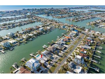 Aerial view of waterfront home with private dock and boat slip at 11280 7Th E St, Treasure Island, FL 33706