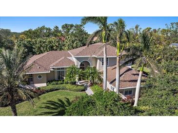 Aerial view of two story house with surrounding landscape at 1802 97Th Nw St, Bradenton, FL 34209