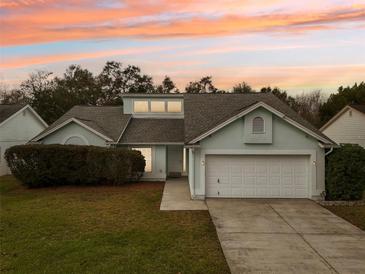 Charming one-story home with a two-car garage and manicured lawn at 4113 Barret Ave, Plant City, FL 33566