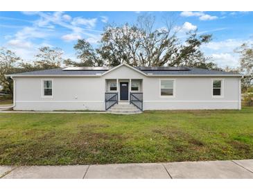 Newly built home featuring solar panels and a modern design at 902 W Alsobrook St, Plant City, FL 33563