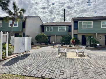 Front view of condo building, showing building exterior and landscaping at 1028 Apollo Beach Blvd # 11, Apollo Beach, FL 33572