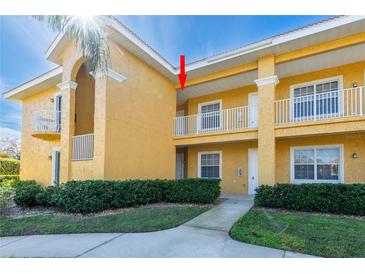 Building exterior showcasing a well-maintained building with attractive landscaping at 21012 Picasso Ct # J205, Land O Lakes, FL 34637