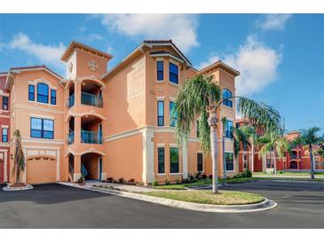 Attractive condo building with palm trees and ample parking at 2749 Via Cipriani # 1010B, Clearwater, FL 33764