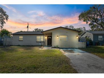 Cute brick home with a well-manicured lawn and a long driveway at 3724 15Th Se Ave, Largo, FL 33771