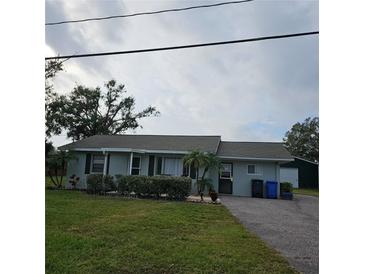 Ranch-style home with a spacious yard and detached garage at 905 10Th Sw St, Ruskin, FL 33570