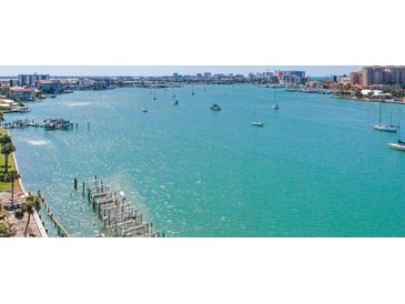 Aerial view showing waterfront property with boats at 660 Island Way # 1005, Clearwater Beach, FL 33767