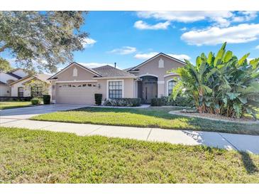 Attractive single-story house with a two-car garage at 13717 Pimberton Dr, Hudson, FL 34669