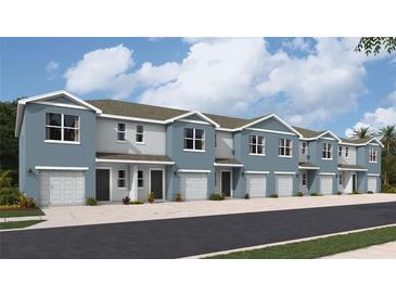 Charming townhomes featuring two-story construction, attached garages, and modern architectural details at 2766 Pearly Banks Dr, Bradenton, FL 34208