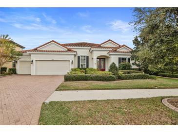 Beautiful one-story home with tile roof and lush landscaping at 11910 Climbing Fern Ave, Riverview, FL 33579