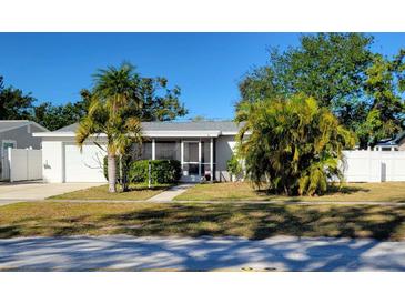 Single story home with attached garage and fenced yard at 10819 86Th Ave, Seminole, FL 33772