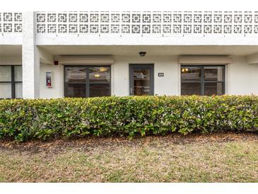 Building exterior featuring unit entrance and landscaping at 4910 Bay Ne St # 109, St Petersburg, FL 33703