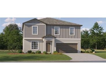 Two-story home with gray siding, brown garage door, and landscaped lawn at 3768 Capital Reserve Dr, Plant City, FL 33565