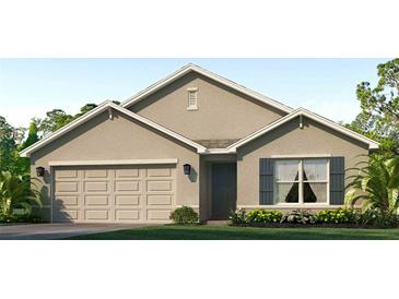 Two-story house with neutral siding, two-car garage, and landscaping at 18207 Canopy Pl, Lakewood Ranch, FL 34211