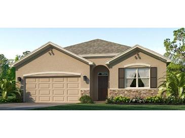 One-story home with tan siding, stone accents, and a two-car garage at 18212 Canopy Pl, Lakewood Ranch, FL 34211