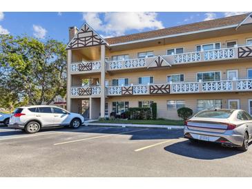 Building exterior showcasing ample parking and a well-maintained landscaping at 2311 Brisbane St # 1, Clearwater, FL 33763