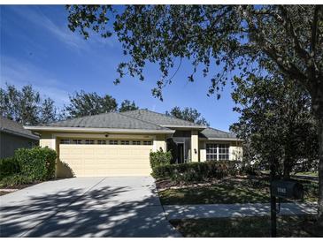 Single-story house with a two-car garage and well-maintained landscaping at 11142 Irish Moss Ave, Riverview, FL 33569