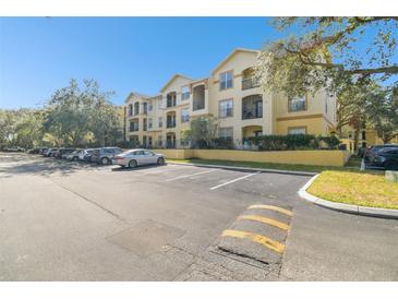 Apartment building with ample parking at 5612 Pinnacle Heights Cir # 304, Tampa, FL 33624