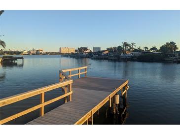 Wooden dock extending over calm water, offering scenic waterfront views at 7824 3Rd S Ave, St Petersburg, FL 33707