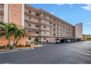 Three-story condo building with parking and landscaping at 8174 Terrace Garden N Dr # 110, St Petersburg, FL 33709