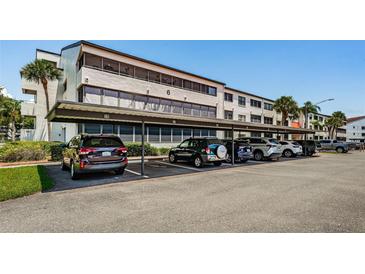 Covered parking area with ample spaces for residents at 2587 Countryside Blvd # 6303, Clearwater, FL 33761