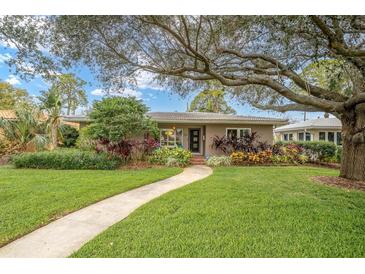 Single-story home with landscaped yard and walkway at 266 Snell Isle Ne Blvd, St Petersburg, FL 33704