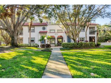Updated condo building with manicured lawn and walkway at 492 Santa Cruz Ne Pl # D, St Petersburg, FL 33703