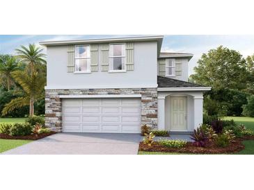 Two-story house with stone accents and a two-car garage at 5249 Salt Marsh Rd, Wimauma, FL 33598