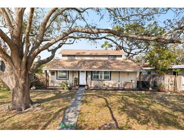 Charming raised ranch home with mature landscaping and large oak tree at 6327 2Nd S Ave, St Petersburg, FL 33707