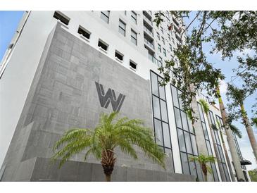 Modern building exterior with gray stone and palm trees at 226 5Th N Ave # 1106, St Petersburg, FL 33701