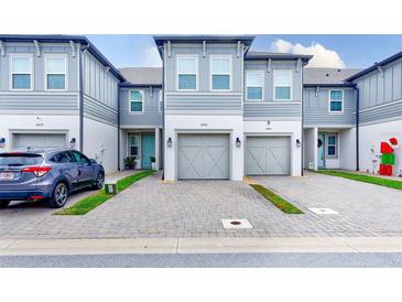 Modern townhome with 2-car garage and paved driveway at 2441 Foggy Creek Cir, Clearwater, FL 33764