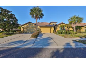 Attractive single-story home with two-car garage and lush landscaping at 5608 Sunset Falls Dr, Apollo Beach, FL 33572