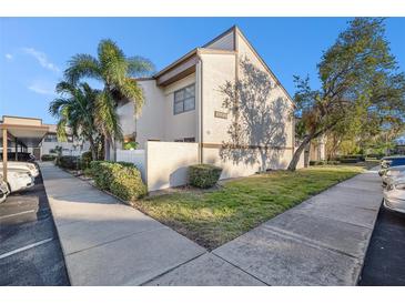 Exterior view of condo with landscaped grounds at 9209 Seminole Blvd # 209, Seminole, FL 33772