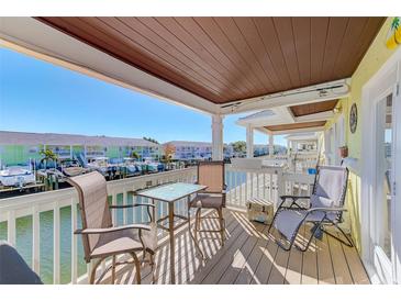 Relaxing balcony with water views and seating for two at 5116 Beach Se Dr # D, St Petersburg, FL 33705
