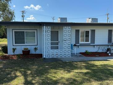 Charming single-story home with decorative white privacy screen and well-maintained front yard at 1002 N Pebble Beach Blvd # 1002, Sun City Center, FL 33573
