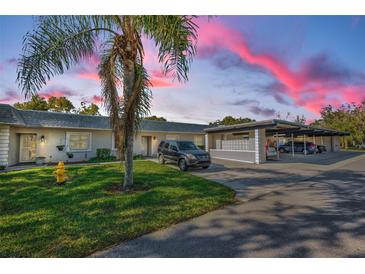 Attractive condo building with carport and landscaping at 3521 Teeside Dr # 3521, New Port Richey, FL 34655