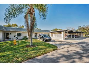Condo building with parking and landscaping at 3521 Teeside Dr # 3521, New Port Richey, FL 34655