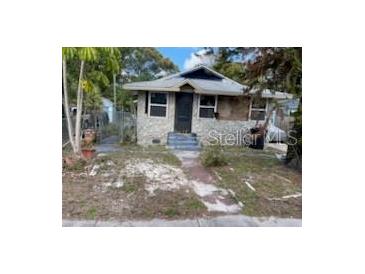 Fixer-upper home with stone exterior, needs renovation at 615 Newton S Ave, St Petersburg, FL 33701