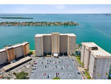 Aerial view of waterfront highrise building with parking and bay views at 5200 Brittany S Dr # 1204, St Petersburg, FL 33715