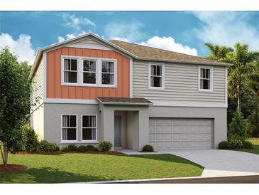 Two-story house with orange accents and a two-car garage at 14729 Summer Branch Dr, Lithia, FL 33547