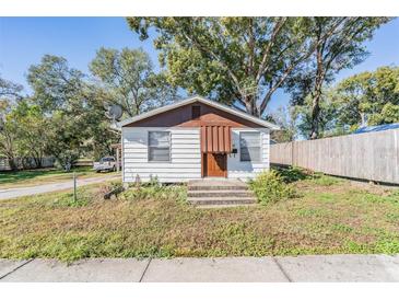 Charming one-story home with a brown roof and well-maintained lawn at 14035 21St St, Dade City, FL 33525